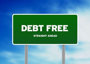 Green Debt Free highway sign on Cloud Background.